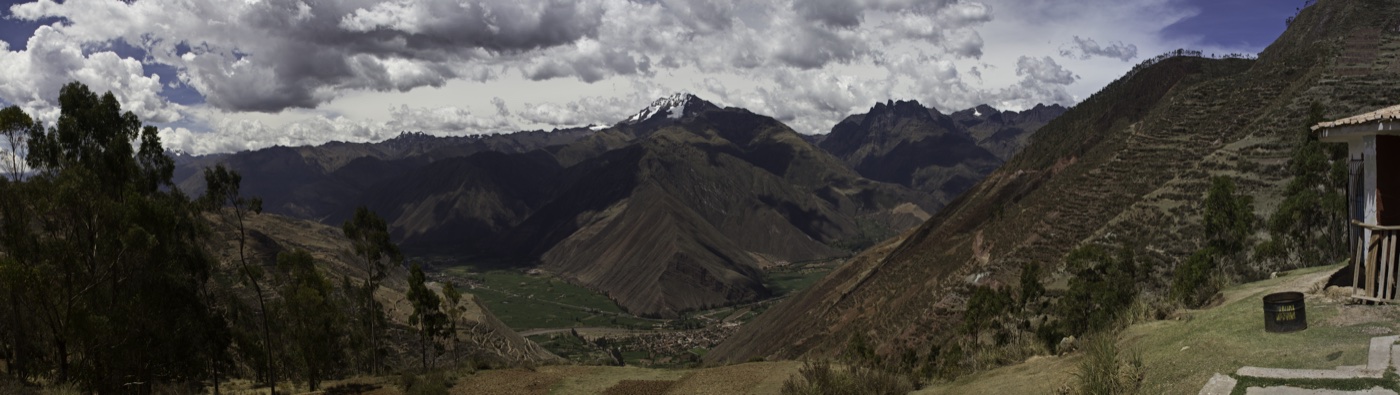 The Sacred Valley of the Incas, a snow-capped peak above terraced slopes falling to the valley floor