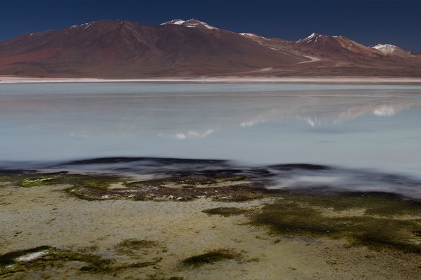 A white lake on Bolivia's Altiplano under a vast sky